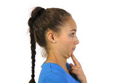 A photo of a woman doing a chin tuck