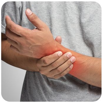 Zoomed in image of a wrist which is glowing red to indicate pain. The wrist is being held by the person's other hand.
