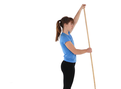 A photo of a women holding a long stick with two hands